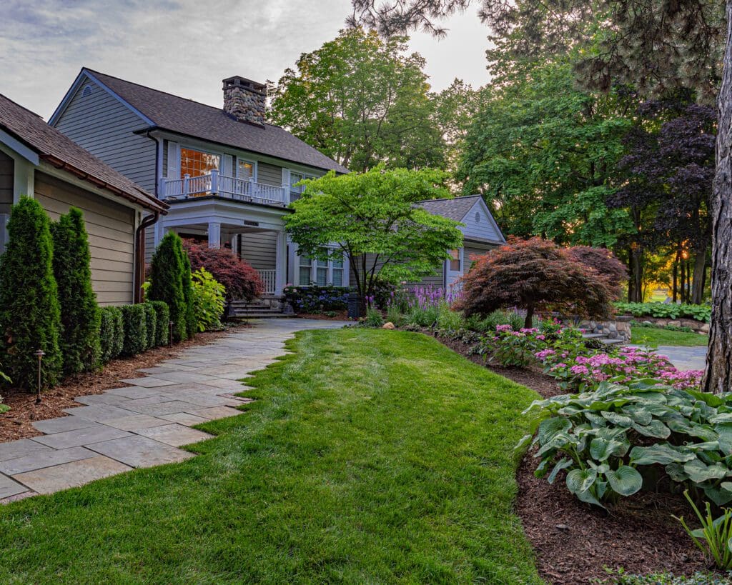 House with garden and stone pathway.