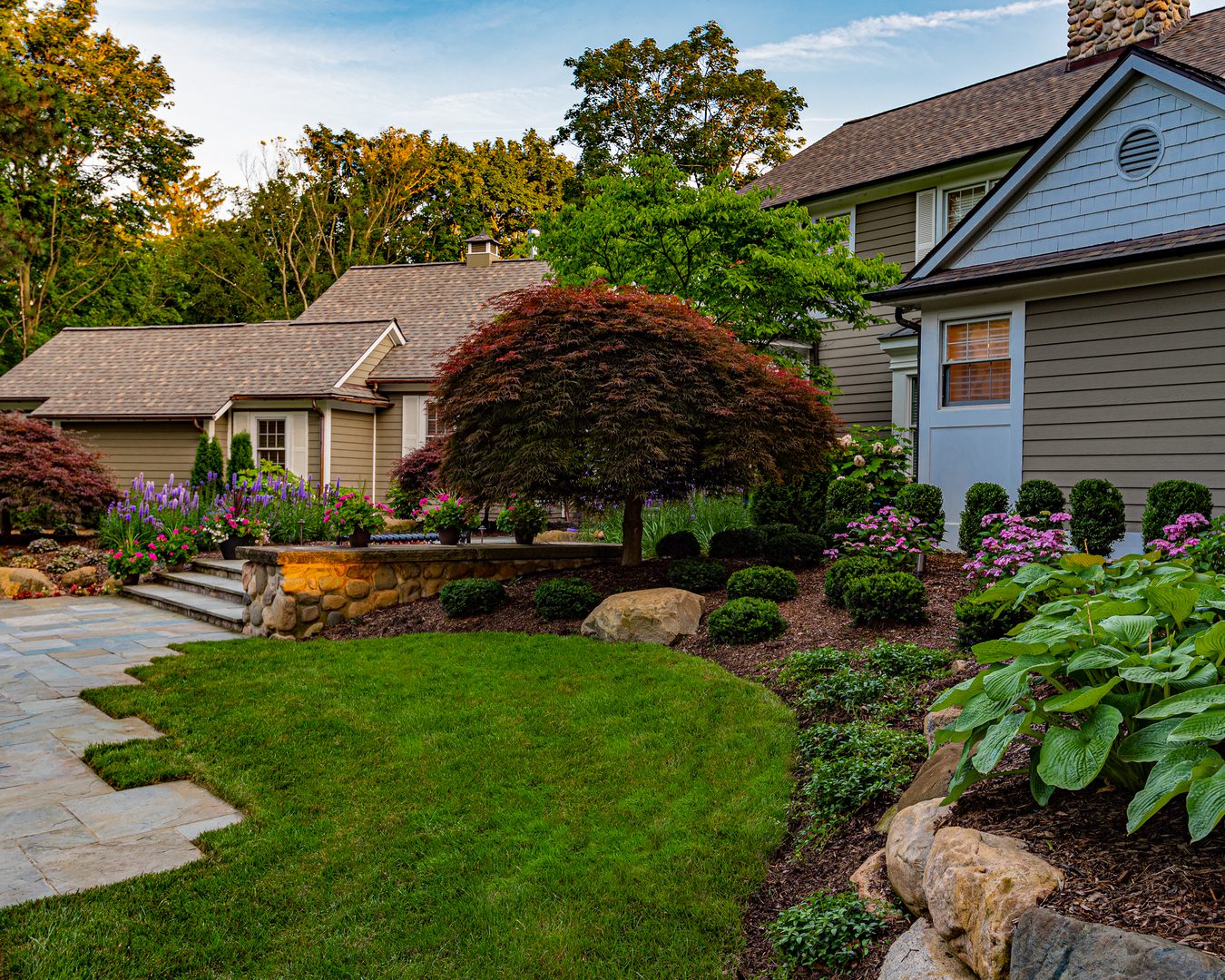 env-3 House with landscaped garden and stone pathway.