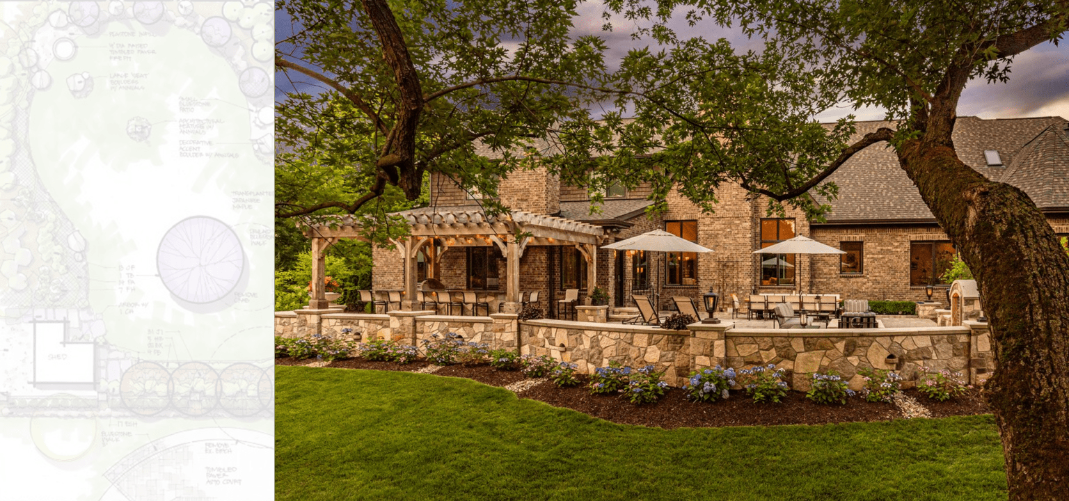 Stone house with lush garden and patio.