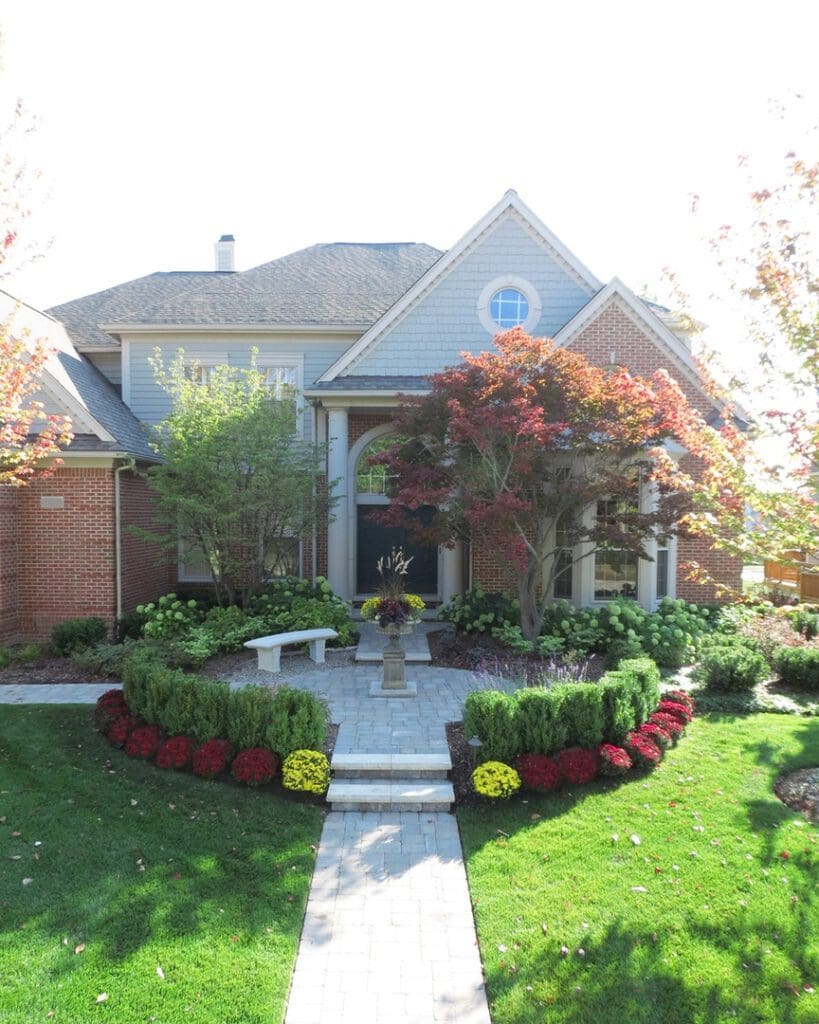 Large house with landscaped front yard.