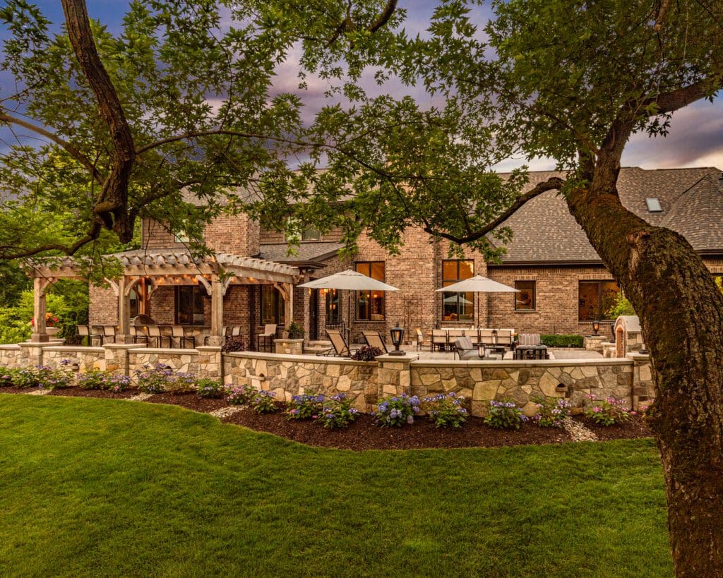Elegant house with patio and lush garden.