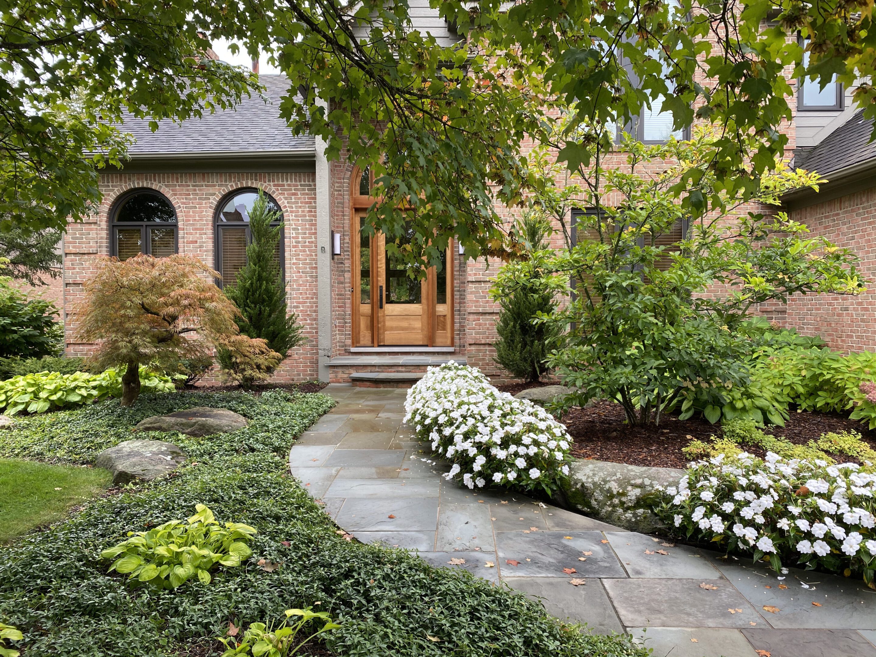 A house with a garden and flowers in the yard